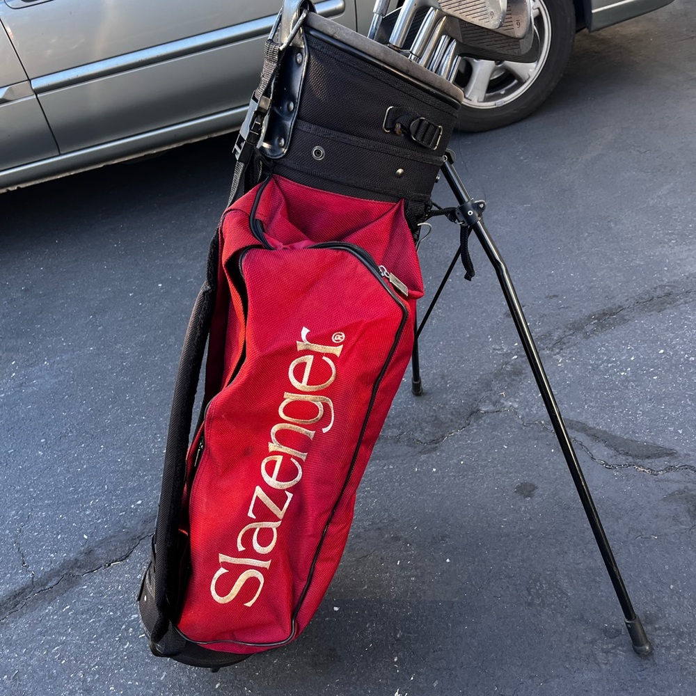 Slazenger golf bag with miscellaneous golf clubs